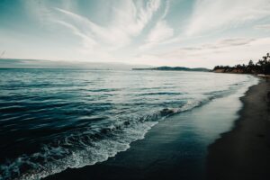 shoreline under blue sky